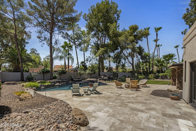 view of patio / terrace with a fenced in pool and a fenced backyard