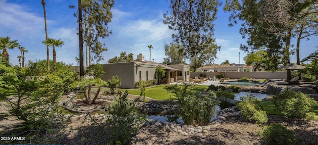 exterior space with a patio area, fence, and a fenced in pool