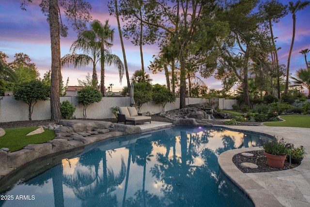 view of swimming pool featuring a fenced in pool and a fenced backyard