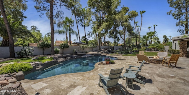 view of pool featuring a fenced in pool, an outdoor fire pit, a patio area, and a fenced backyard