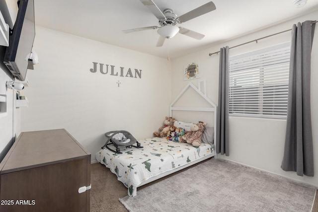 carpeted bedroom with ceiling fan