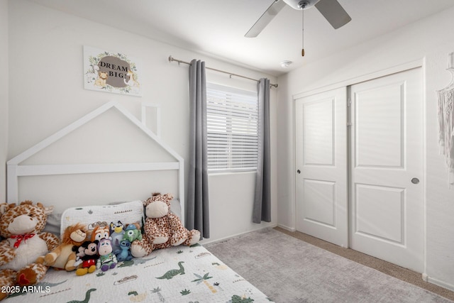 unfurnished bedroom with a closet, ceiling fan, and light carpet