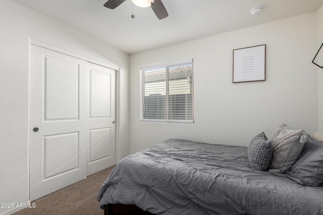 bedroom with carpet flooring, a closet, and ceiling fan