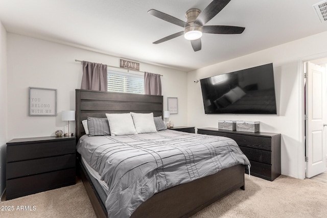 bedroom featuring light colored carpet and ceiling fan