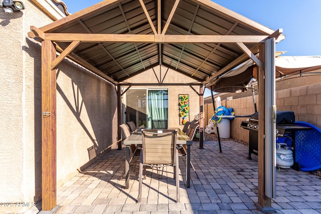 view of patio / terrace with area for grilling and a gazebo