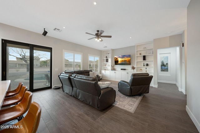 25454 N 73rd Ave, Peoria, AZ 85383 - living area featuring baseboards, dark wood finished floors, visible vents, a ceiling fan, and built in features