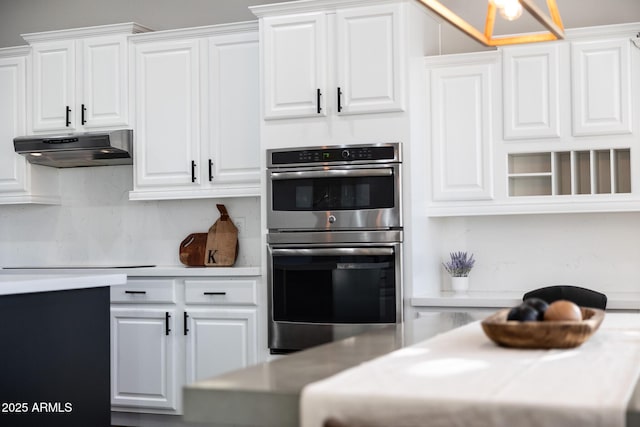 25454 N 73rd Ave, Peoria, AZ 85383 - kitchen featuring double oven, light countertops, under cabinet range hood, and white cabinetry