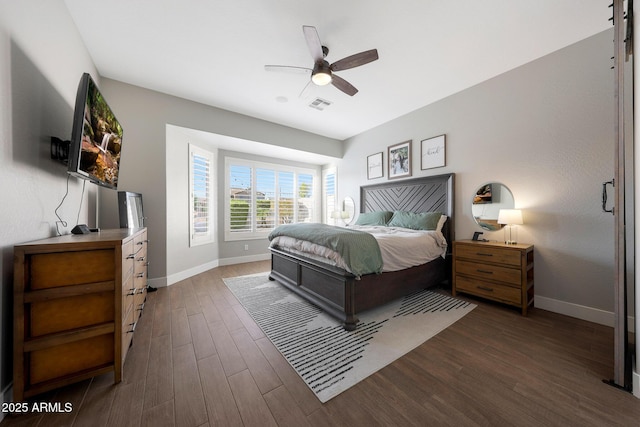 25454 N 73rd Ave, Peoria, AZ 85383 - bedroom featuring dark wood-style floors, visible vents, baseboards, and a ceiling fan