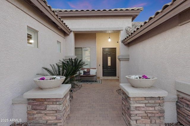 25454 N 73rd Ave, Peoria, AZ 85383 - entrance to property featuring a tiled roof, stucco siding, and a patio