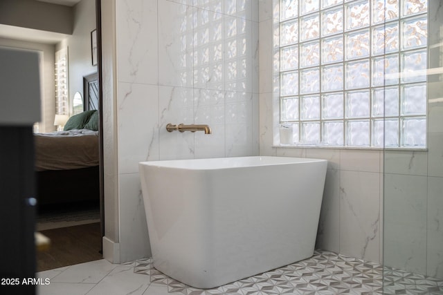 25454 N 73rd Ave, Peoria, AZ 85383 - bathroom featuring a freestanding tub, tile walls, and ensuite bathroom