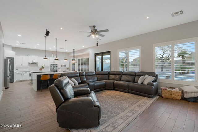 25454 N 73rd Ave, Peoria, AZ 85383 - living area with a ceiling fan, visible vents, light wood finished floors, and recessed lighting