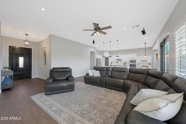 25454 N 73rd Ave, Peoria, AZ 85383 - living area featuring a wealth of natural light, dark wood finished floors, baseboards, arched walkways, and ceiling fan