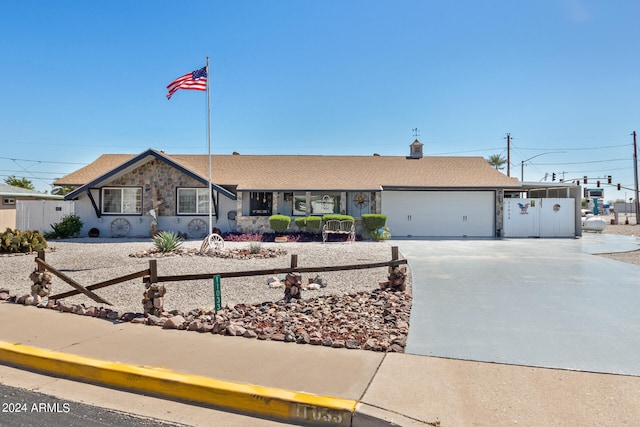 ranch-style home featuring a garage