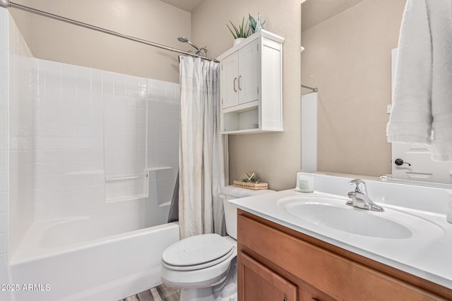 bathroom with toilet, vanity, and shower / tub combo