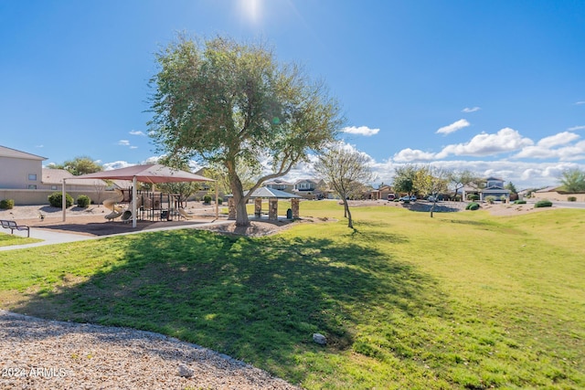 view of yard featuring a gazebo and playground community