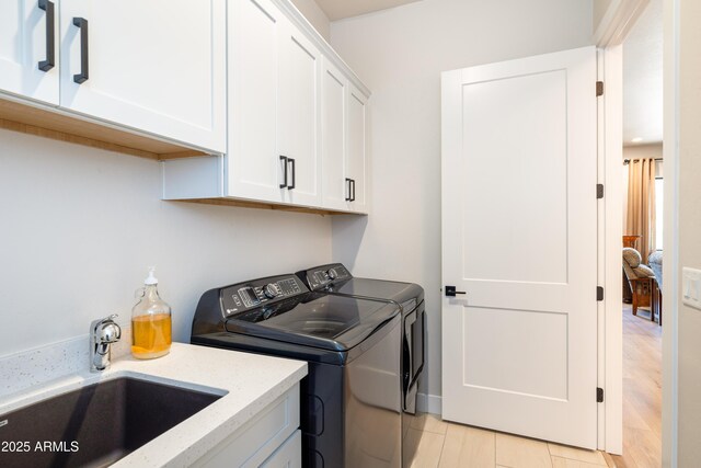 2582 S Cottonrose Ln, Flagstaff, AZ 86001 - clothes washing area featuring washing machine and dryer and cabinet space