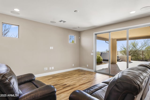 living room with light hardwood / wood-style flooring