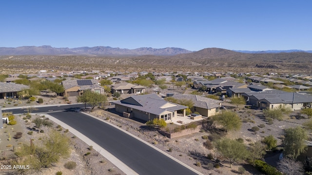 birds eye view of property with a mountain view