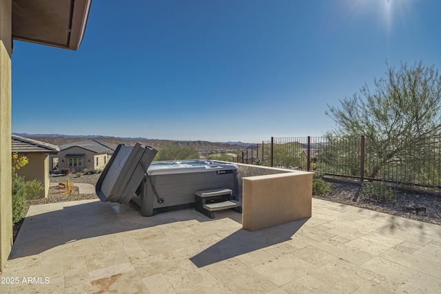 view of patio / terrace with a hot tub