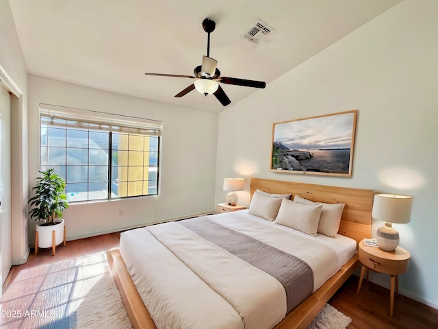 7801 N 44th Dr Unit 1180, Glendale, AZ 85301 - bedroom featuring wood finished floors, lofted ceiling, and a ceiling fan