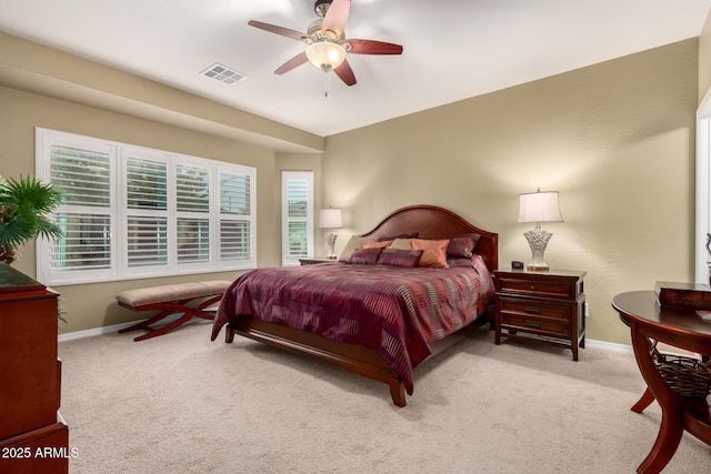 bedroom featuring carpet, visible vents, baseboards, and ceiling fan