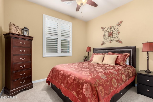 bedroom with carpet floors, a ceiling fan, and baseboards