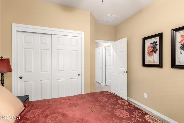 bedroom featuring a closet, visible vents, and baseboards