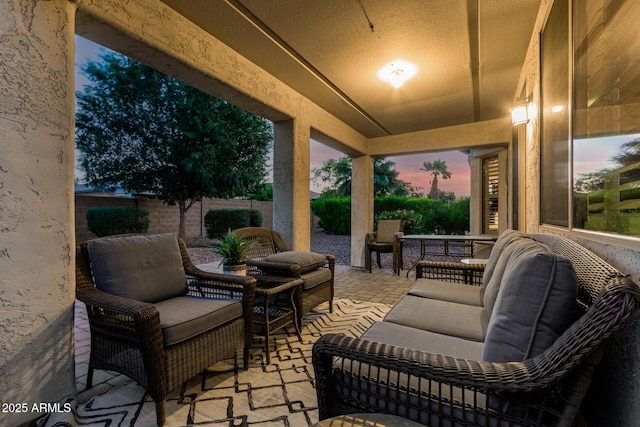 view of patio with fence and an outdoor hangout area