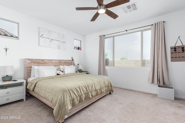 bedroom featuring ceiling fan and light carpet