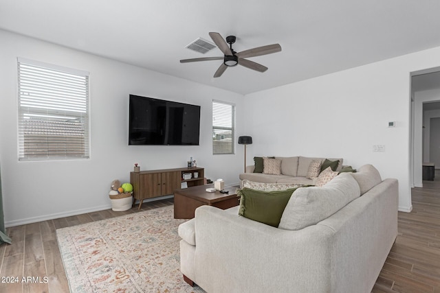 living room with hardwood / wood-style flooring and ceiling fan