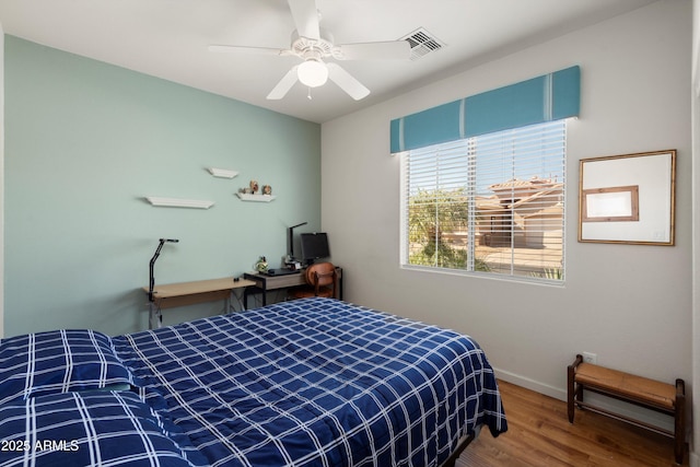 17611 W Ingleside Dr, Surprise, AZ 85374 - bedroom featuring visible vents, ceiling fan, wood finished floors, and baseboards