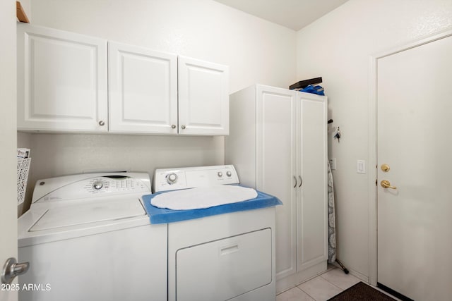 17611 W Ingleside Dr, Surprise, AZ 85374 - washroom with light tile patterned floors, cabinet space, and washer and clothes dryer