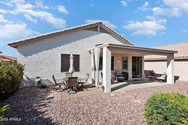 17611 W Ingleside Dr, Surprise, AZ 85374 - back of property featuring a patio, stucco siding, and a tiled roof