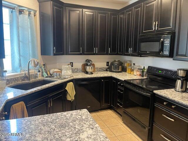 22744 E Carla Vista Dr, Mesa, AZ 85212 - kitchen featuring black appliances, light tile patterned flooring, a sink, and light stone countertops