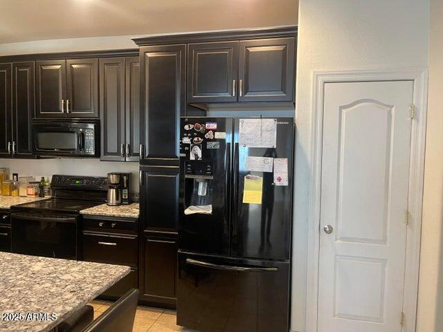 22744 E Carla Vista Dr, Mesa, AZ 85212 - kitchen with light tile patterned floors, black appliances, light stone countertops, and dark brown cabinets