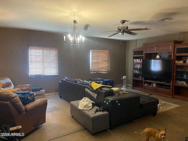 22744 E Carla Vista Dr, Mesa, AZ 85212 - living area featuring visible vents, light carpet, and ceiling fan with notable chandelier