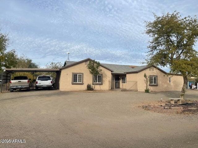 22744 E Carla Vista Dr, Mesa, AZ 85212 - ranch-style house with dirt driveway and stucco siding