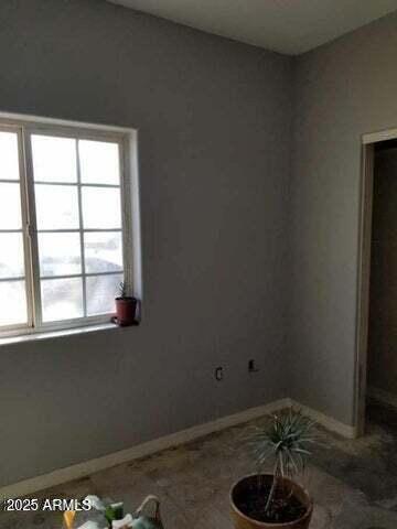 22744 E Carla Vista Dr, Mesa, AZ 85212 - spare room with baseboards and a healthy amount of sunlight