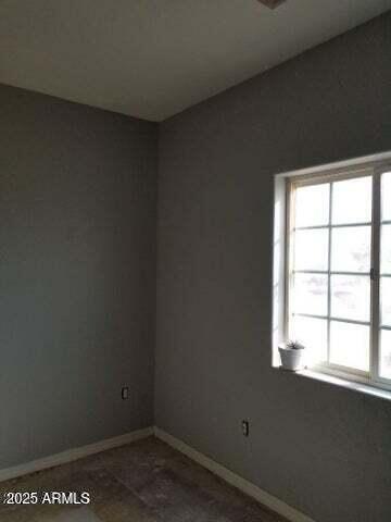 22744 E Carla Vista Dr, Mesa, AZ 85212 - unfurnished room with a healthy amount of sunlight and baseboards