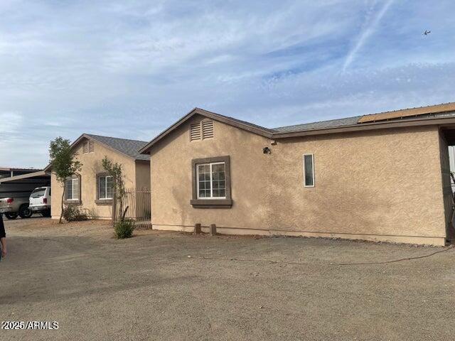 22744 E Carla Vista Dr, Mesa, AZ 85212 - view of side of home featuring stucco siding