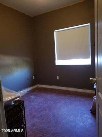 22744 E Carla Vista Dr, Mesa, AZ 85212 - spare room with dark carpet and baseboards
