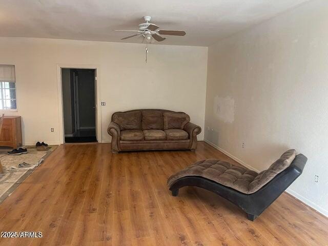 22744 E Carla Vista Dr, Mesa, AZ 85212 - living room with ceiling fan, wood finished floors, and baseboards
