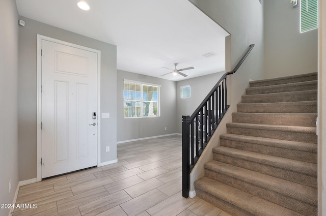 foyer featuring ceiling fan