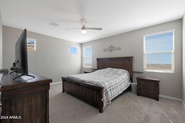 carpeted bedroom featuring ceiling fan