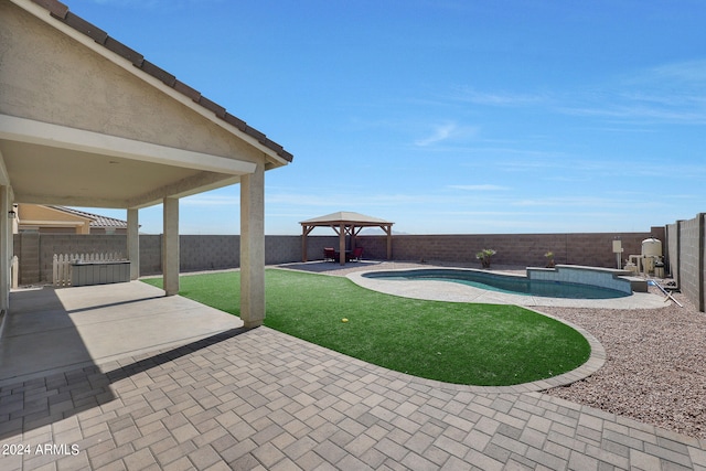 view of yard with a gazebo, a fenced in pool, and a patio area