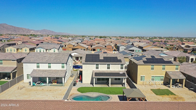 birds eye view of property with a mountain view