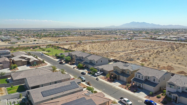 birds eye view of property featuring a mountain view