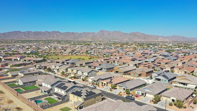 birds eye view of property featuring a mountain view