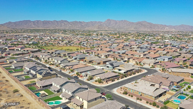 birds eye view of property with a mountain view