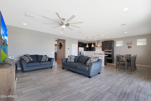 living room featuring ceiling fan